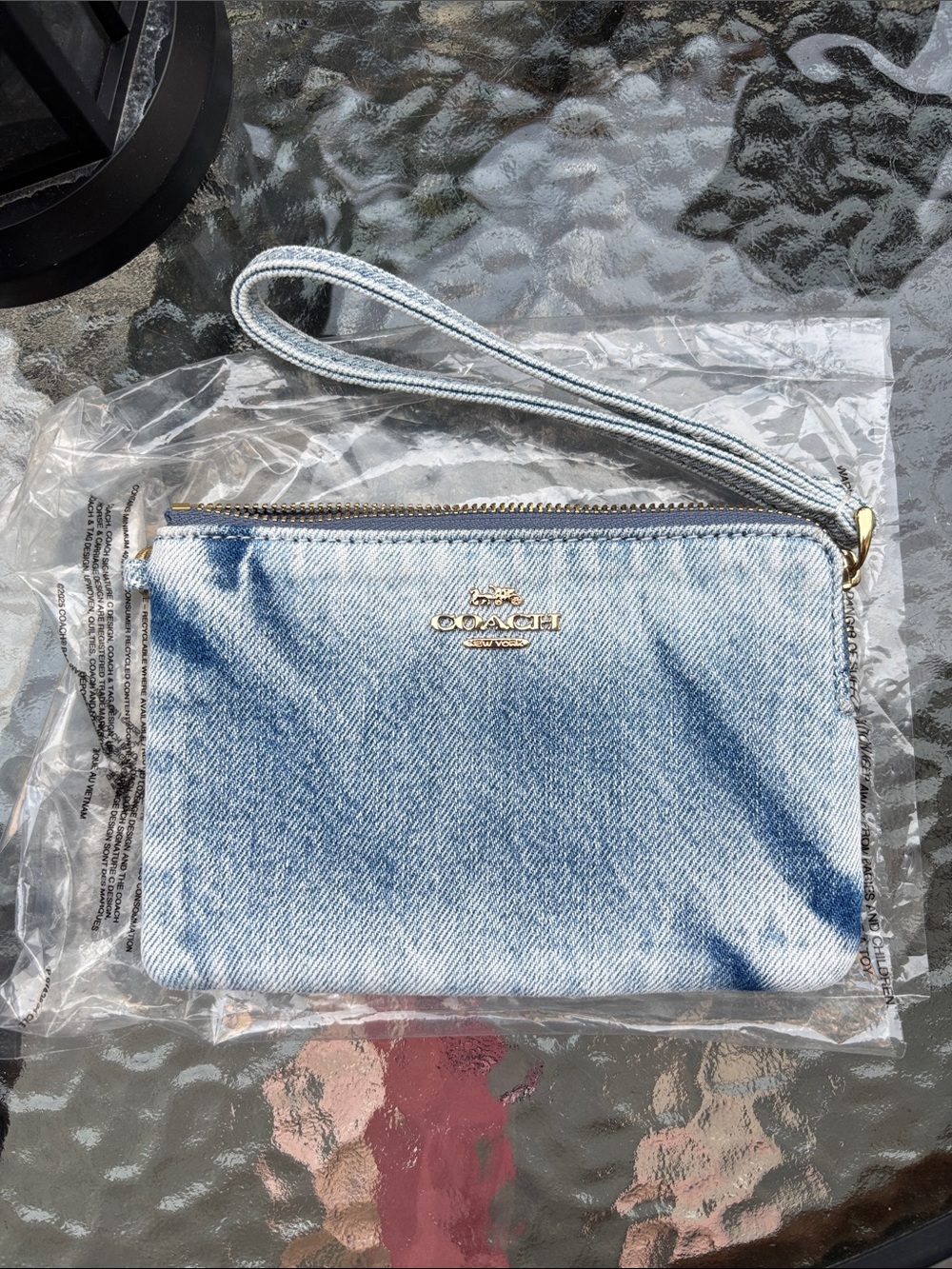 Coach Corner Zip Wristlet
In Loved Denim New no charms
